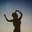 Woman silhouette against star field