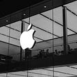 Black and white picture of apple store facade and logo.