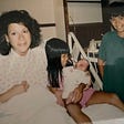 The author, Susan Yem, with three of her children at the hospital.