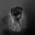 Photo of a brown fist statue.