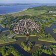 https://nieuwehollandsewaterlinie.nl/route/rondwandeling-naarden-vesting-5-km/luchtfoto-vesting-naarden-2/