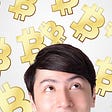Man looking at Bitcoin symbols