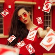 A pictue of a beautiful woman doing some card tricks. This depicts the kind of magic Liverpool has to do to overthrow City to the EPL title this 2021/2022 season.