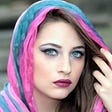 Woman wearing blue and pink scarf, thinking
