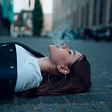 a woman smoking outside
