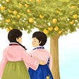 Two women in Korean hanboks stand in front of an orange tree looking at each other with one woman’s arm around the other.