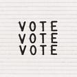 “Vote” written on a letter board.