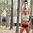 Kassandra Aveni / Hobart and James Hobart working out outside in woods