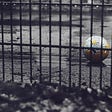 Abandoned soccer ball in empty schoolyard