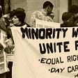 Photo of a protest from the civil rights movement of a group of black women carrying a sign that says, “Minority Women Unite for Equal Rights, Day Care, Abortion”