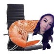 Courtney’s head is photoshopped onto a shrimp sitting in an office chair.