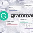 The Grammarly logo and poor scoring report details sit atop crumpled pieces of writing paper.