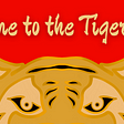 An article cover banner for the Tiger Team NFT project. The cover features a golden tiger peering over the edge under the title “Welcome to the Tiger Team”.