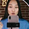Young female content creator recording a video