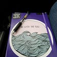 picture of a purple journal with a pen