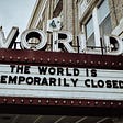 World Theatre sign that reads: The World is Temporarily Closed