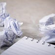 Crumpled up papers resulting from writer’s block