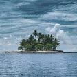 An image of a desert island with palm trees.
