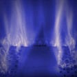 Flames inside a gas central heating boiler. A blue coloured filter has been applied for dramatic effect.