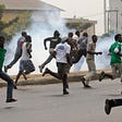People running for their lives during a peaceful protest which was invaded by cultist and thugs