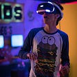 A person wearing a VR headset and a funny T-shirt looks surprised.