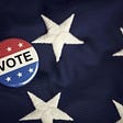 Vote pin on the stars of the American flag