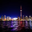 A beautiful photo of the skyline of the city of Toronto taken at night.