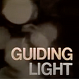 Guiding Light’s title card in all caps, set in a light filled background.