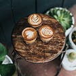 Three cups of coffee on a stool