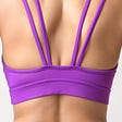 The back of a model wearing Recreative Apparel’s sports bra