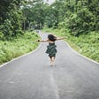 Girl running barefoot on an unobstructed path