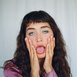 Young woman pulling face about toxic products