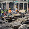 Workers fix a massive water main break in New York City in 2014.