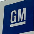 General Motors logo on a sign.