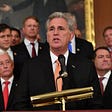 Kevin McCarthy speaking in front of podium.