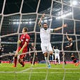 Claudio Pizarro of Bremen celebrates his team’s first goal during a soccer match in Leverkusen, Germany.