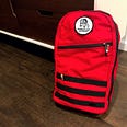 Red Goruck Bullet 15L standing upright