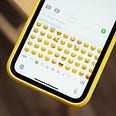Emoji keyboard showing different emojis on mobile phones