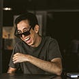 man in sunglasses, laughing