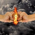 Two fists bumping each other with fire and explosion between fists.