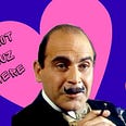 David Suchet as Hercule Poirot in front of hearts