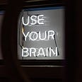 photo of a sign that says use your brain