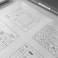 4 hand drawn wireframes in a white dotted paper