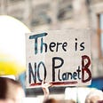Photo from a ‘Save the Planet’ rally. Focus on a sign “There is NO Planet B”