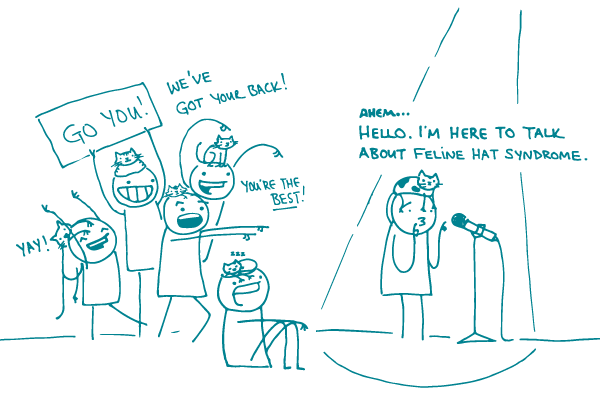 Illustration of a doodle at a microphone, with a cat on their head, saying "Ahem...Hello. I'm here to talk about feline hat syndrome." as a group of other doodles with cats on their heads cheer, saying "We've got your back!" "You're the best!" and "Yay," with another holding a sign saying "Go you!"