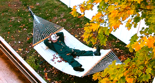 Horror villain Michael Myers relaxes in a hammock on a fall day