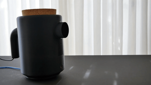 Place 2 by artist Kaii Tu. A kettle that pours light by projecting a generative white pattern onto a surface.