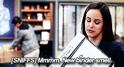 Amy Santiago from Brooklyn 99 with a lovely folder