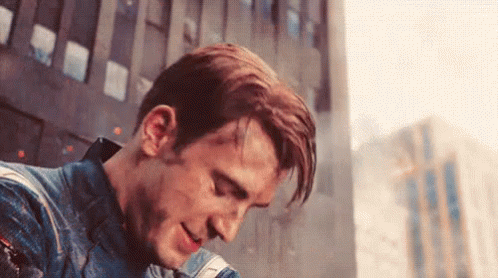 Steve Rogers, Captain America, dirty and tired but happy.
