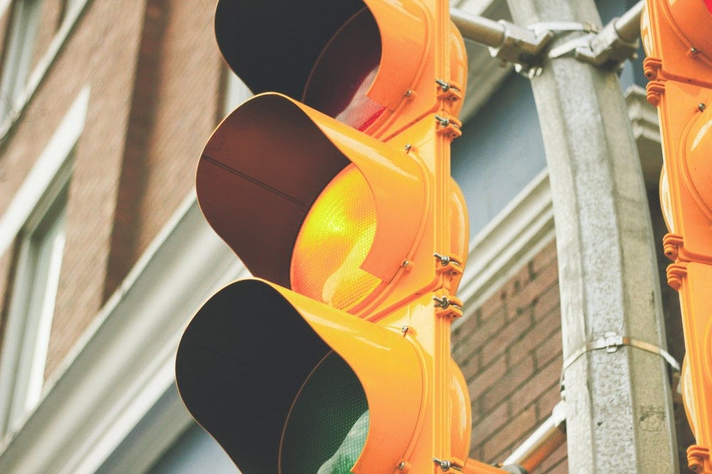 What Does a Yellow Light Mean?. Slow Down by David Langiulli Medium